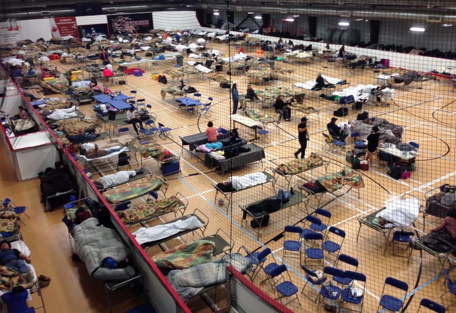 Cots are set up on the gym floor at an evacuee reception center, operated by the regional municipality of Wood Buffalo in Anzac, Alberta, Canada, on Wednesday.  More than 80,000 residents were ordered to flee the Canadian oil sands city of Fort McMurray, as a wildfire moved into the city, destroying whole neighborhoods.