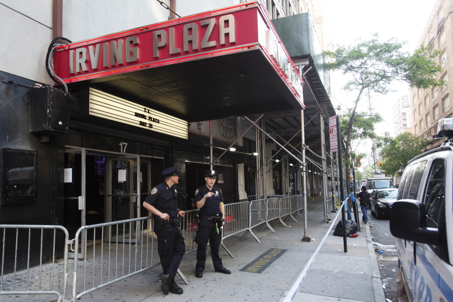 Police officers stand outside Irving Plaza on Thursday in New York.  Shots rang out inside the concert venue Wednesday night, where hip-hop artist T.I. was getting ready to perform.