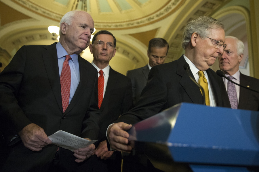 Sen. John McCain, R-Ariz., left, arrives to speak during a news conference with Senate Majority Leader Sen. Mitch McConnell, R-Ky. on Capitol Hill in Washington on May 24. From left are, McCain, Sen. John Barrasso, R-Wyo., Sen. John Thune, R-S.D., McConnell, and Senate Majority Whip John Cornyn of Texas.