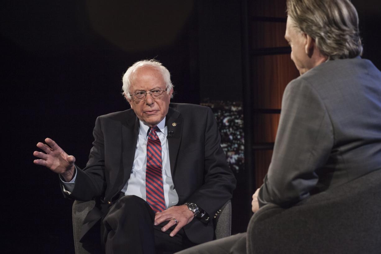 In this photo provided by HBO, Democratic presidential candidate Sen. Bernie Sanders, I-Vt., left, speaks with host Bill Maher during an interview on the television show, "Real Time With Bill Maher," Friday, May 27, 2016, in Los Angeles.