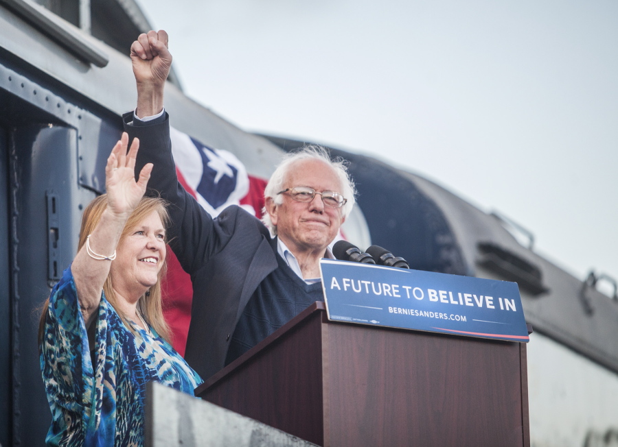 Democratic presidential candidate Bernie Sanders and his wife, Jane, wave to the crowd Saturday in Bowling Green, Ky.