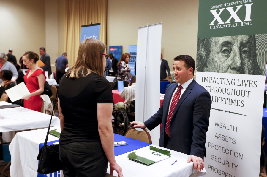 Recruiters speak March 30 to attendees at a job fair in Pittsburgh. The U.S. government reported Friday that employers added 160,000 jobs in April.