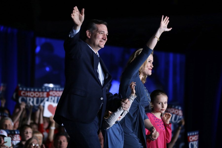 Republican presidential candidate Sen. Ted Cruz, R-Texas, waves with his wife Heidi and daughters, Caroline, right, and Catherine, during a rally at the Indiana State Fairgrounds in Indianapolis on Monday.