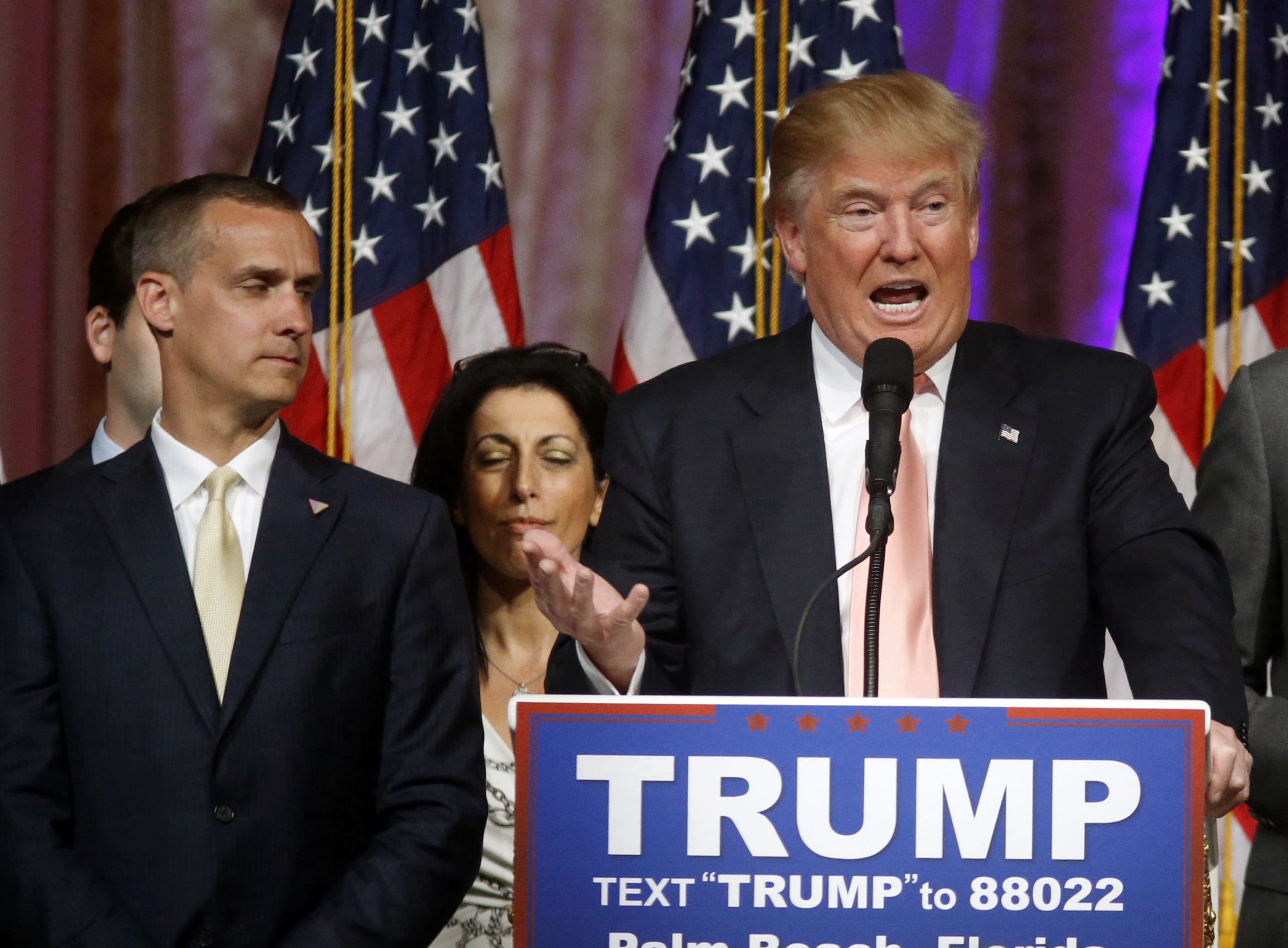 FILE - In this March 15, 2016, file photo, Republican presidential candidate Donald Trump speaks to supporters at his primary election night event at his Mar-a-Lago Club in Palm Beach, Fla., as campaign manager Corey Lewandowski listens at left. Trumps penchant for encouraging rivalries and pitting even those closest to him against each other is roiling his Republican presidential campaign as he plunges into the general election. The tensions boiled over last week with the abrupt ouster of political director Rick Wiley, who left the campaign after just six weeks.