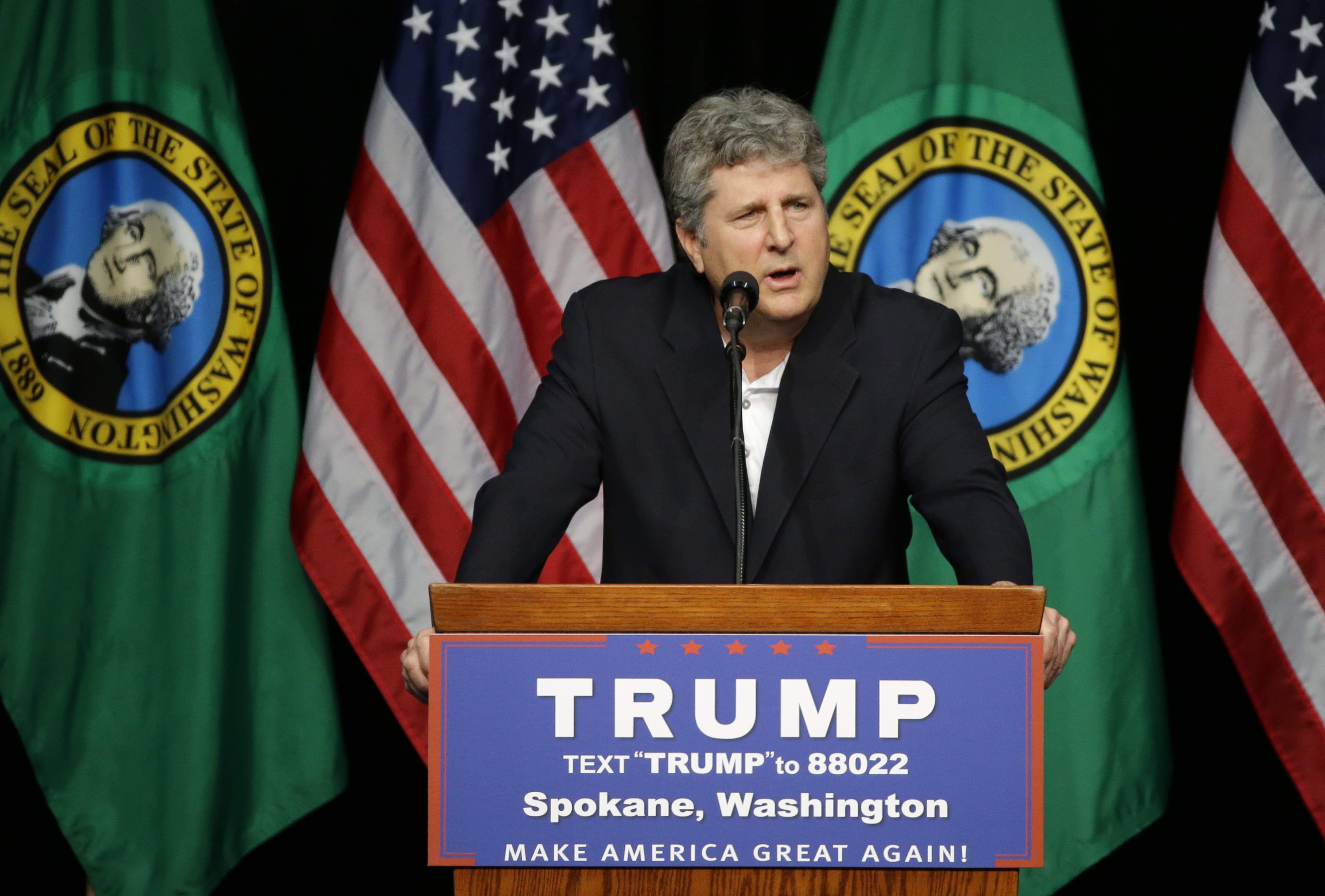 Mike Leach head football coach at Washington State University, speaks in support of Republican presidential candidate Donald Trump during a rally in Spokane, Wash., Saturday, May 7, 2016. (AP Photo/Ted S.