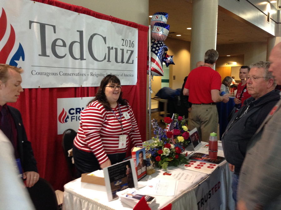 Jennifer Fetters of Bellevue works the Ted Cruz booth at the Washington state GOP convention in Pasco on Thursday.  (AP Photo/Nicholas K.