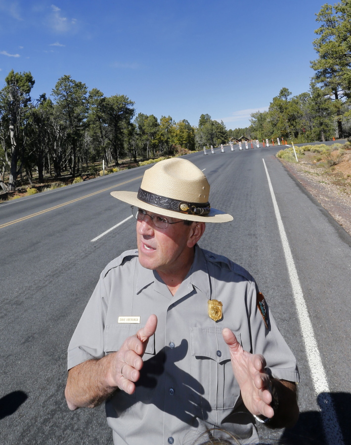 Grand Canyon National Park Superintendent Dave Uberuaga speaks at the blocked entrance of the Grand Canyon on Oct. 8, 2013. Uberuaga has chosen retirement over a transfer after being told the park needed new leadership.