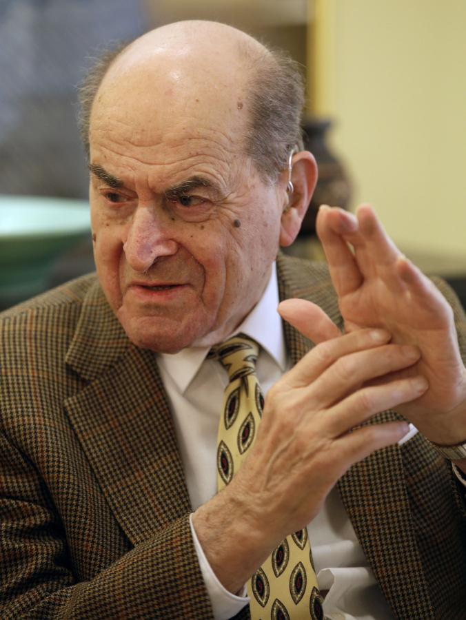 Dr. Henry Heimlich on Feb. 5, 2014, describes the maneuver he developed to help clear obstructions from the windpipes of choking victims, while being interviewed at his home in Cincinnati. Heimlich recently used the emergency technique for the first time himself to save a woman choking on food at his senior living center. Heimlich said Thursday that he has demonstrated the well-known maneuver many times through the years but had never before used it on a person who was choking.
