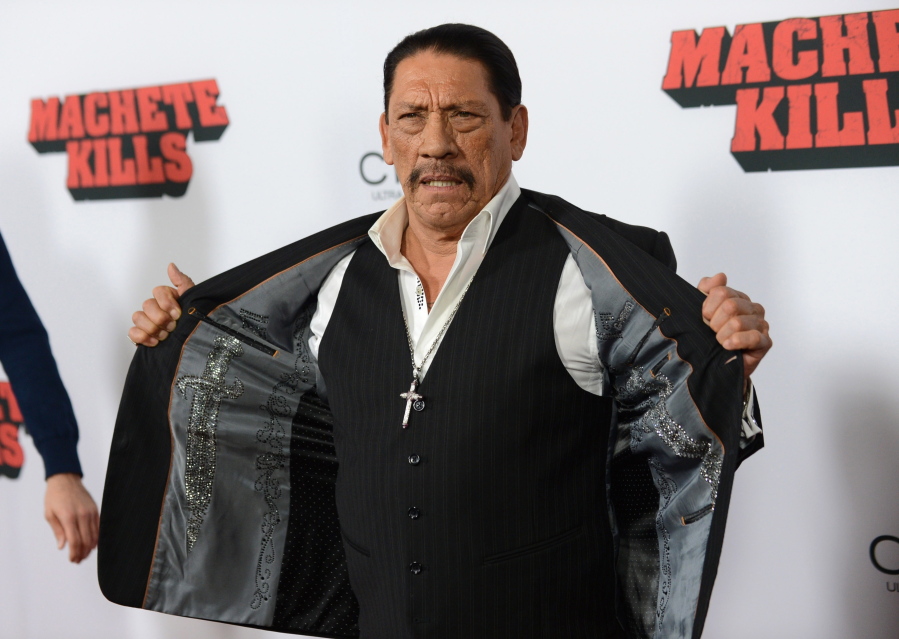 Actor Danny Trejo arrives Oct. 2, 2013, at the premiere of &quot;Machete Kills&quot; at Regal Cinemas L.A. Live in Los Angeles. The Los Angeles Times reports Trejo took the floor at a community meeting at Sylmar High School in Los Angeles on Wednesday following a brawl at the school.