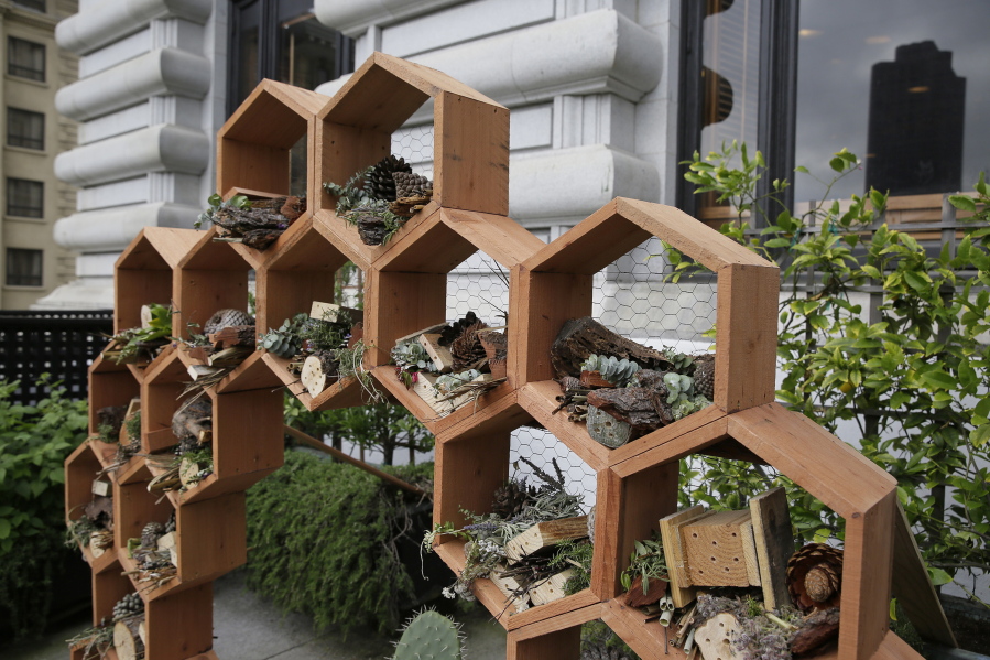 A new pollinator bee hotel stands May 4 in a garden area at the Fairmont Hotel in San Francisco. Aware of the well-publicized environmental threats to honeybees that have reduced numbers worldwide, several San Francisco hotels have built hives on their rooftops.