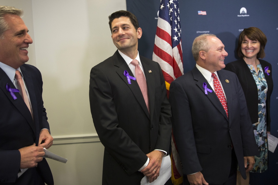 House Speaker Paul Ryan of Wis., second from left, stands with, from left, House Majority Leader Kevin McCarthy of Calif., House Majority Whip Steve Scalise of La., and Rep. Cathy McMorris Rodgers, R- Wash., during a news conference on Capitol Hill in Washington on Wednesday.