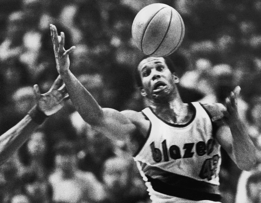 FILE - In this Dec. 25, 1979, file photo, Portland Trail Blazers&#039; Kermit Washington gains control of a loose ball during an NBA basketball game against the Golden State Warriors in Portland, Ore. Former NBA player Kermit Washington is accused of using donations intended to help needy people in Africa for his own gain, including paying for vacations, jewelry and entertainment. U.S. Attorney Tammy Dickinson on Wednesday, May 25, 2016, announced a federal indictment against Washington.