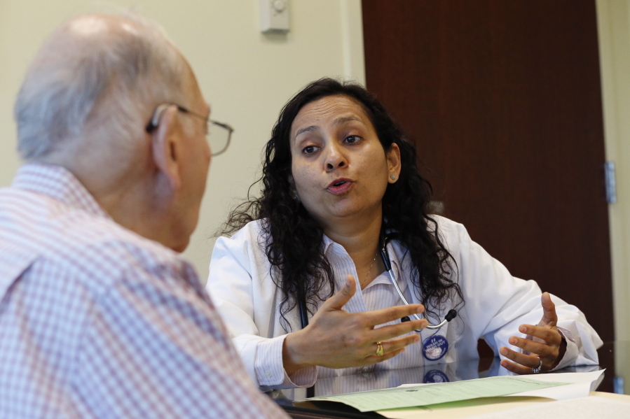 Herbert Diamond, 88, of Fort Lee, N.J., meets with Dr. Manisha Parulekar about his end of life preferences in April at Hackensack Medical Center in Hackensack, N.J.