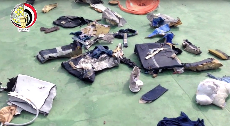 FILE - This file still image taken from video posted Saturday on the official Facebook page of the Egyptian Armed Forces spokesman shows some personal belongings and other wreckage from EgyptAir flight 804 in Egypt. Human remains retrieved from the crash site of EgyptAir Flight 804 suggest there was an explosion on board that may have brought down the aircraft in the east Mediterranean, a senior Egyptian forensics official said on Tuesday.