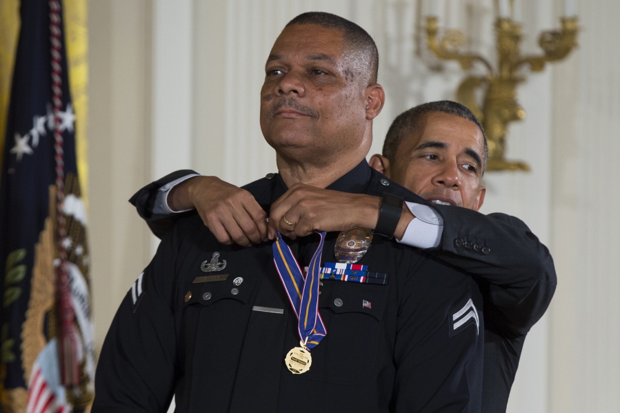 President Barack Obama awards the Medal of Valor to Los Angeles Police Department Officer Donald Thompson during a ceremony in the East Room of the White House in Washington on Monday.