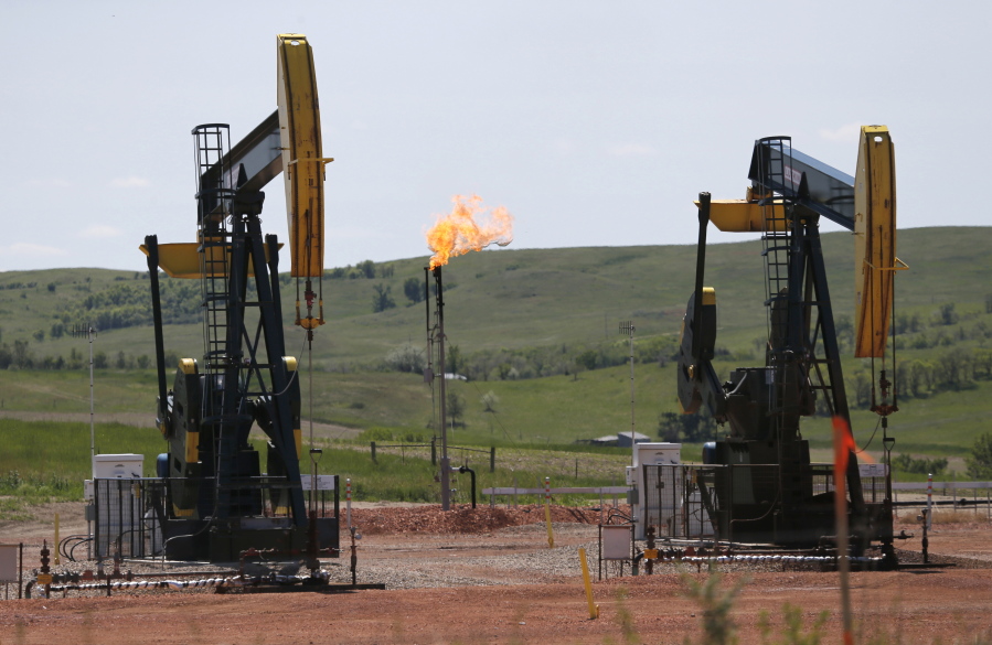 Oil pumps and natural gas burn off in Watford City, N.D., in 2014. Methane emissions will likely be the next big environmental issue to face North Dakota&#039;s booming oil industry according to a top official at the state&#039;s Department of Health.
