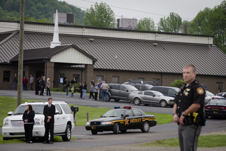 Mourners arrive at Dry Run Church of Christ for funeral services for six of the eight murder victims from Pike County on Tuesday in West Portsmouth, Ohio.  Seven adults and a 16-year-old boy from the Rhoden family were found dead April 22 at four properties scattered across a few miles of countryside near Piketon, about 80 miles east of Cincinnati.