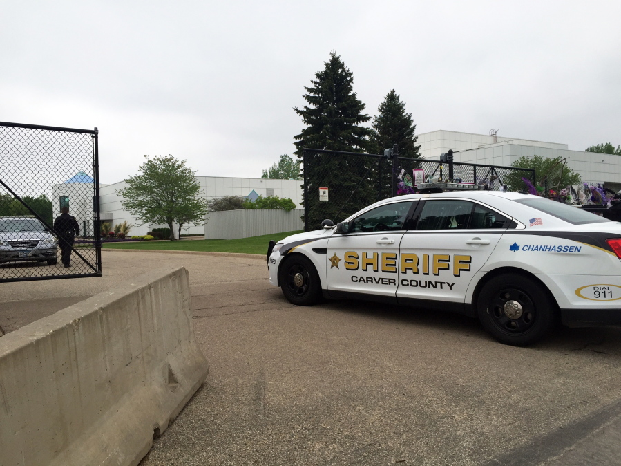 A Carver County Sheriff&#039;s vehicle enters Prince&#039;s Paisley Park home and studio Tuesday in Chanhassen, Minn.