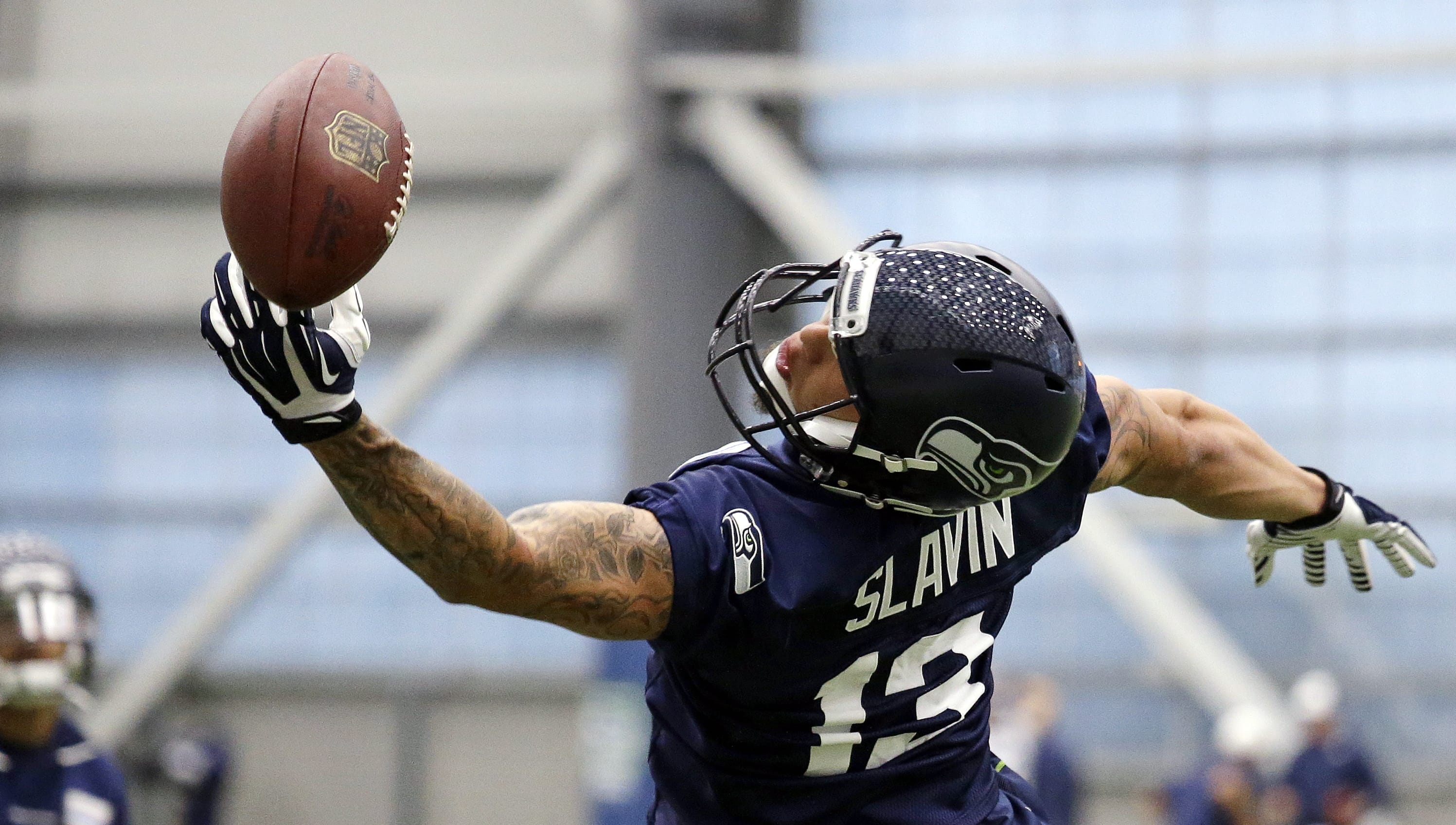 Seattle Seahawks' Tyler Slavin reaches for a pass during an NFL football rookie minicamp workout Sunday, May 8, 2016, in Renton, Wash. He was one of five players signed by the Seahawks on Monday.