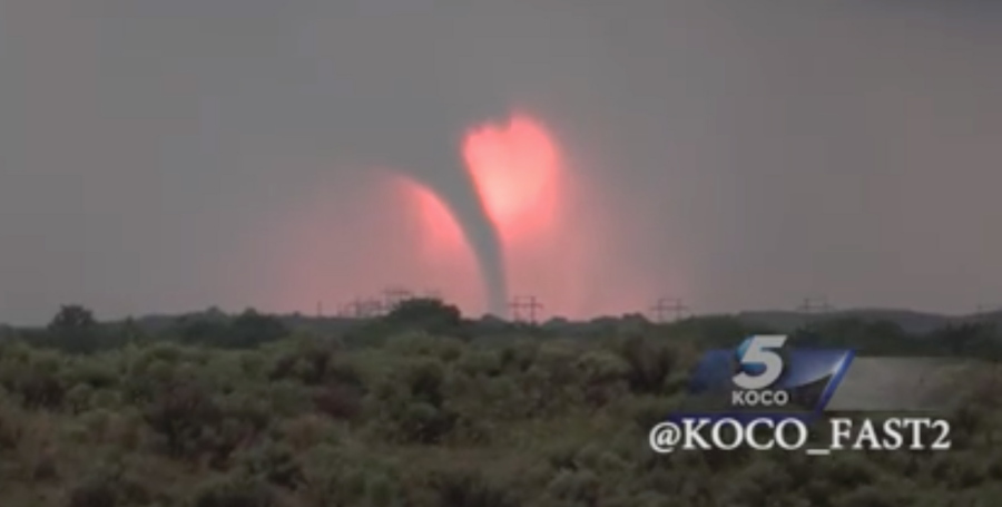 In this Monday, May 23, 2016 frame from video, a tornado moves through the area near Woodward, Okla., as the sun sets. More storms are in the forecast all week, with Kansas, Nebraska, Oklahoma and northeastern Colorado in the crosshairs on Tuesday.