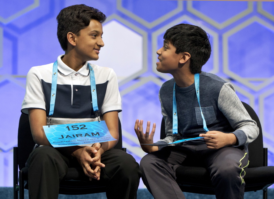 Nihar Janga, 11, of Austin, Texas, right, talks Thursday with Jairam Hathwar, 13, of Painted Post, N.Y., left, after another round where the two went head to head in a drawn out battle that ended in them being named co-champions in the 2016 National Spelling Bee, in National Harbor, Md.