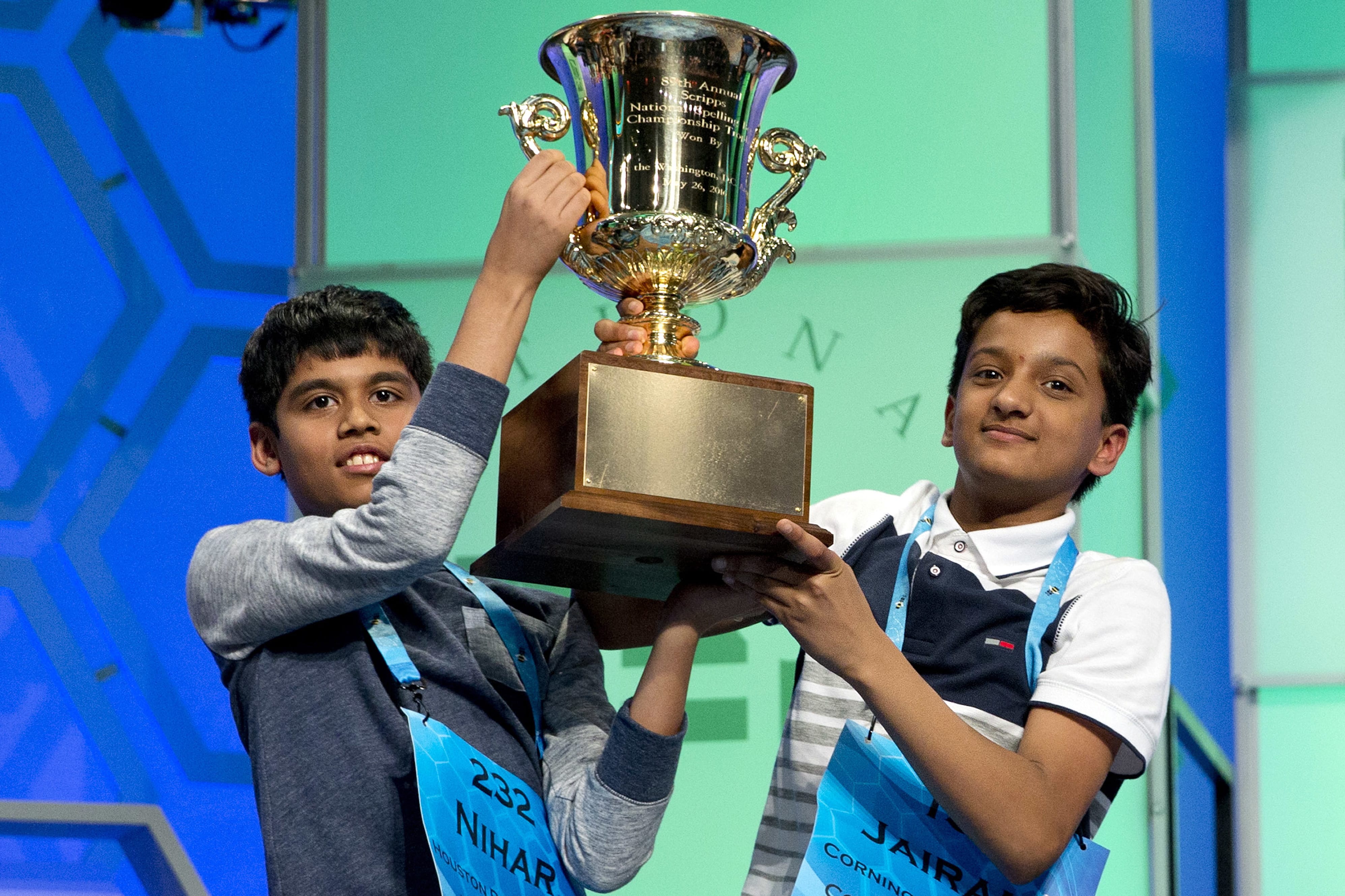 Nihar Janga, 11, of Austin, Texas, left, and Jairam Hathwar, 13, of Painted Post, N.Y., hold up the trophy after being named co-champions at the 2016 National Spelling Bee on Thursday in National Harbor, Md.