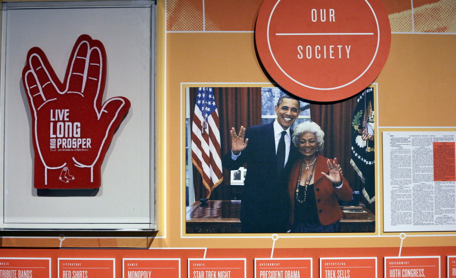 A foam finger in the shape of the Vulcan salute is displayed along with a photo of President Barack Obama and actress Nichelle Nichols, who played Lt. Uhura in &quot;Star Trek,&quot; in a display for the exhibit, &quot;Star Trek: Exploring New Worlds&quot; at the EMP Museum in Seattle. The exhibit opens today.