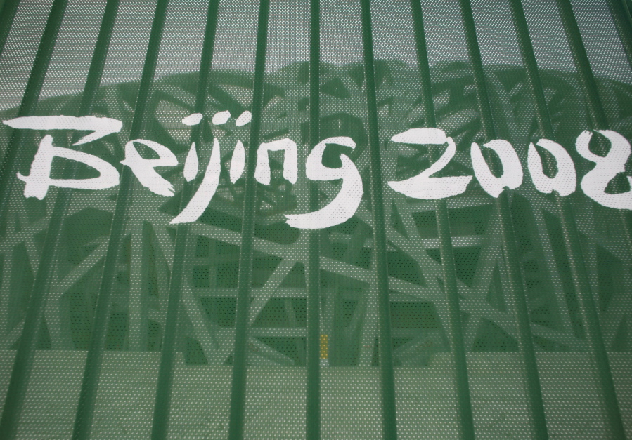A protective fence shows a Beijing 2008 logo outside the National Stadium, known as the &quot;Birds Nest&quot;, in Beijing in 2008.