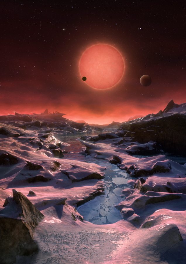 The artist&#039;s impression shows an imagined view from the surface one of the three planets orbiting an ultra-cool dwarf star just 40 light-years from earth that were discovered using the Trappist telescope at ESO&#039;s La Silla Observatory. (M.