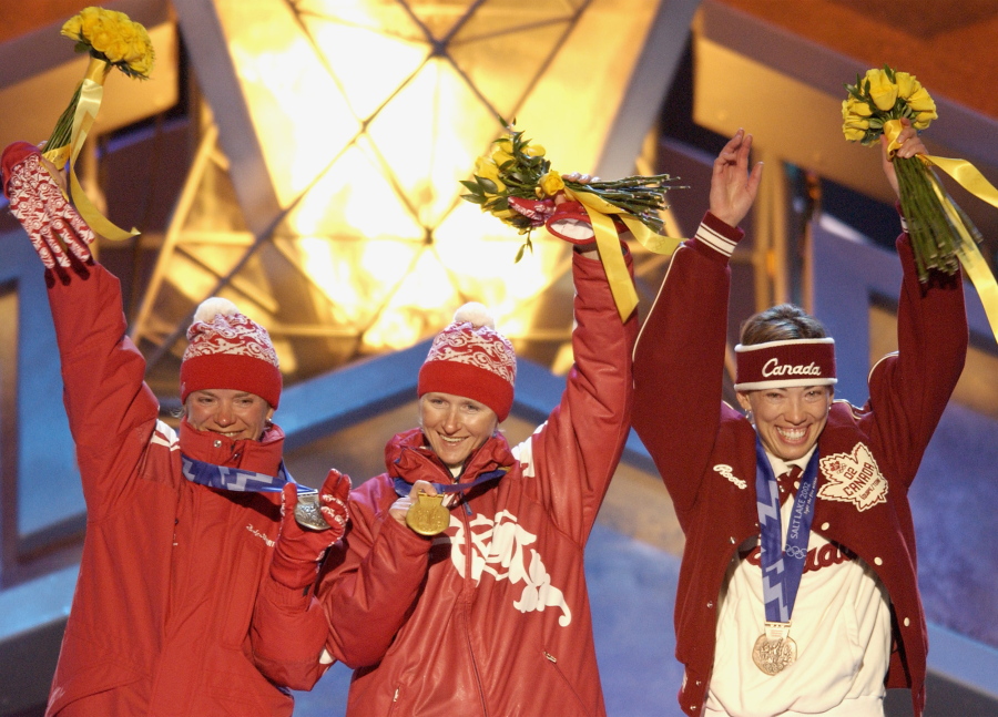 The three Olympic medalists in the women&#039;s 5-kilometer free pursuit alpine skiing event, Russian silver medalist, Larissa Lazutina, left, Russian gold medalist Olga Danilova, center and Canadian bronze medalist Beckie Scott, right, acknowledge the crowd Feb. 15, 2002, after receiving their medals at Medals Plaza in downtown Salt Lake City. Scott gave a speech Thursday in Montreal that reminded all the leaders at the World Anti-Doping Agency why they&#039;re doing all this work.