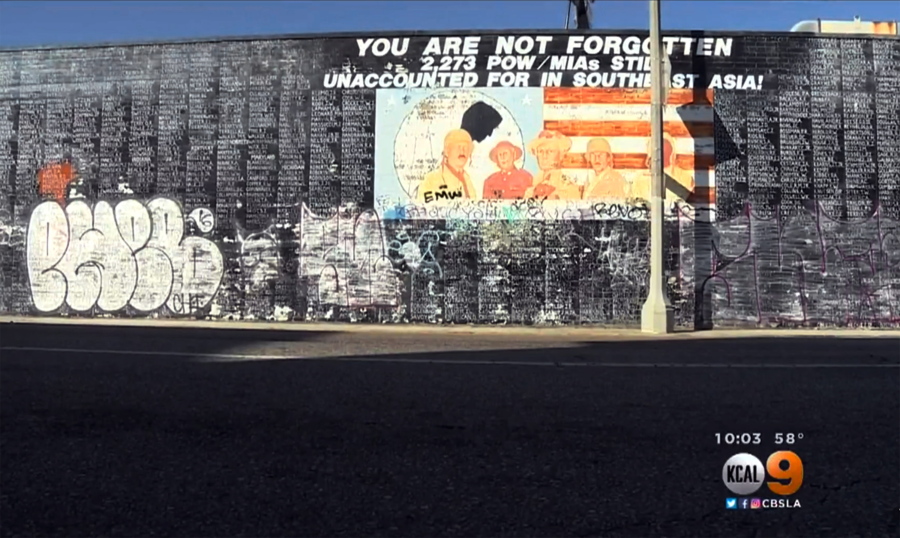 This image from video shows graffiti on a Vietnam War memorial in the Venice area of Los Angeles. The memorial is painted on a block-long wall.