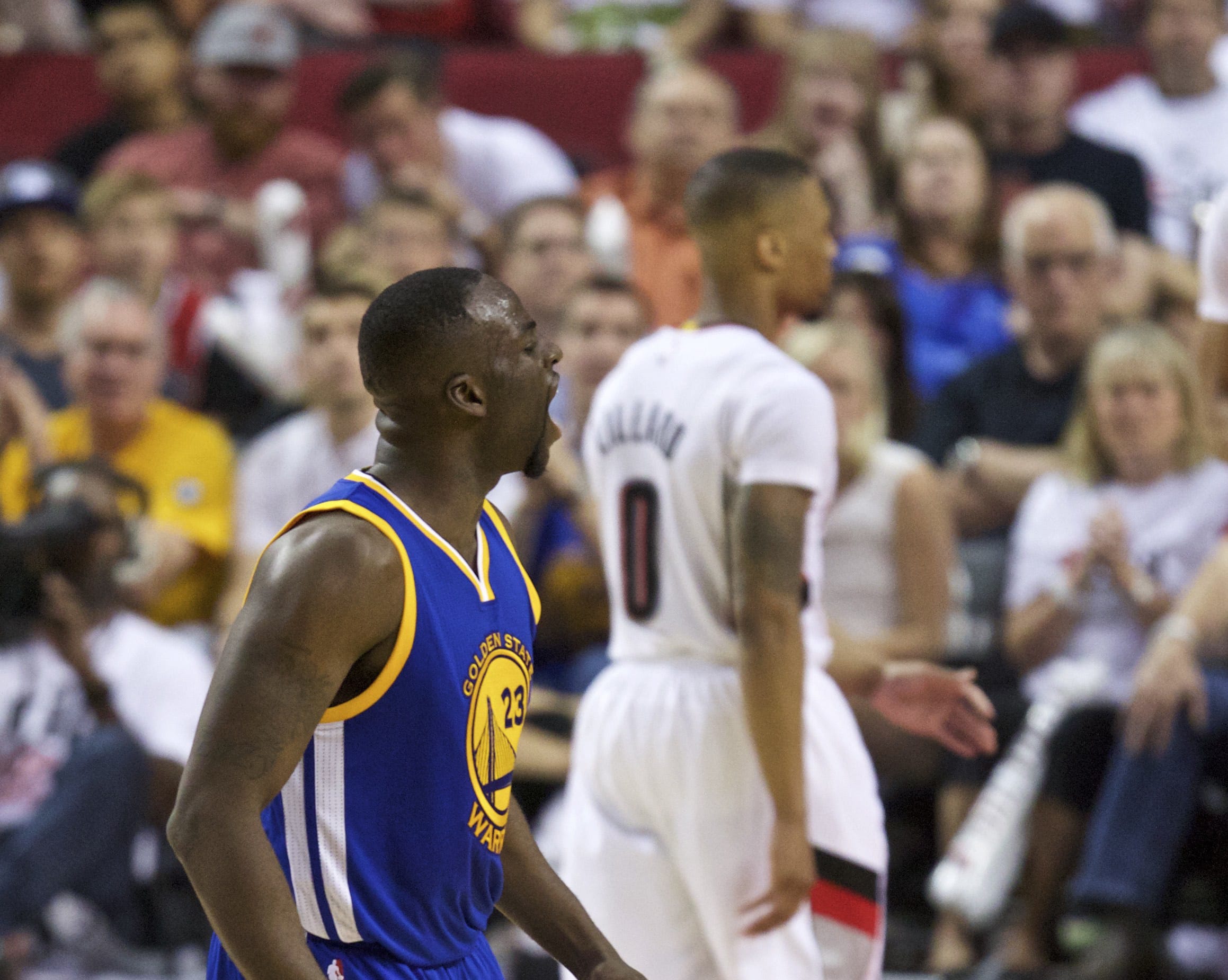 Golden State’s Draymond Green and Portland’s Damian Lillard (background) have exchanged words in the media leading into Monday’s Game 4 in Portland.