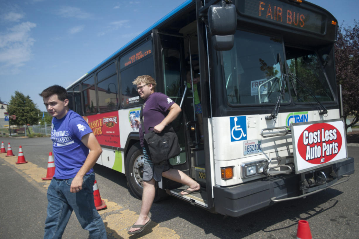 Darrin Breitmayer, left, was one of the passengers who took advantage of C-Tran&#039;s shuttle to the Clark County Fair last summer. The transit agency hopes special services such as the fair buses will attract more riders.