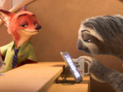 Judy Hopps, voiced by Ginnifer Goodwin, left, and Nick Wilde, voiced by Jason Bateman, second left, star in the animated film, "Zootopia." (Disney)