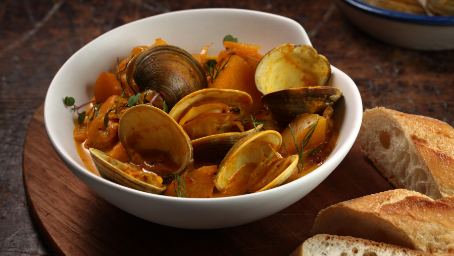 Saffron adds its beautiful fragrance to a bowl of steamed clams. (E.