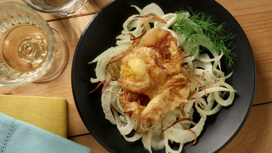 A crunchy fried egg remains as soft as poached inside. It&#039;s served over a shaved fennel salad.