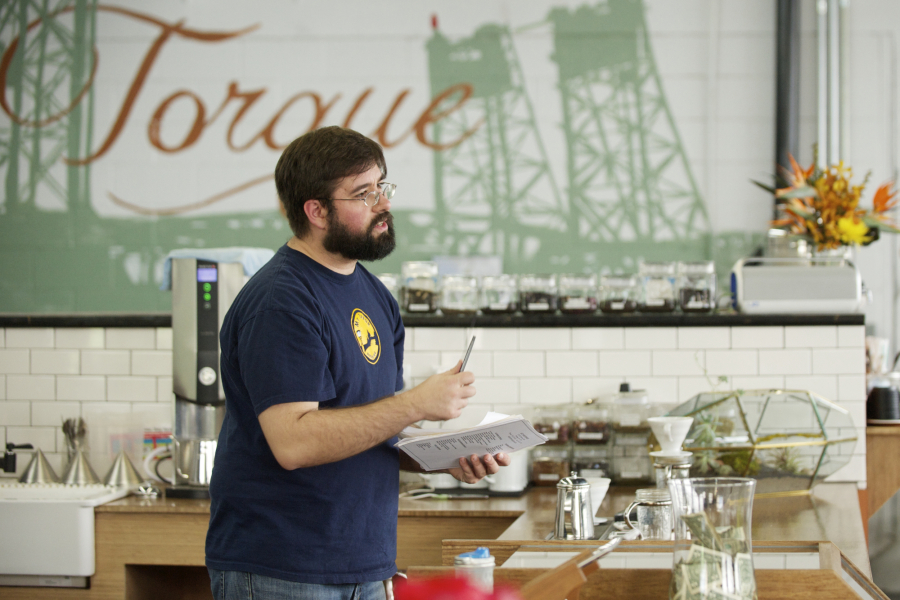 Torque Coffee Roasters owner Ryan Palmer, pictured in the cafe&#039;s former location on Columbia Street, racked up a debt of unpaid loans and back rent for his business that two lawsuits put at more than $90,000.