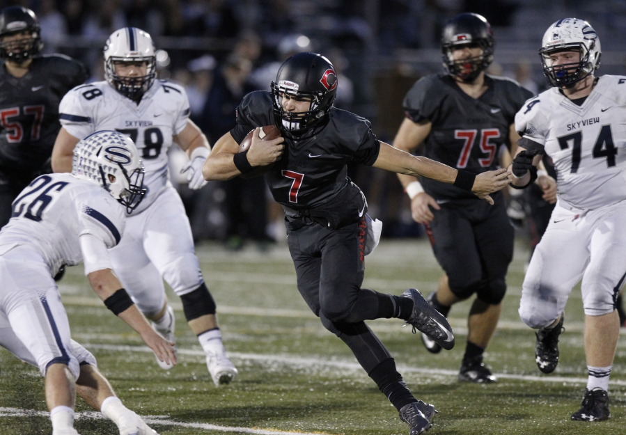 Camas quarterback Liam Fitzgerald (7) runs in playoff game between Skyview and Camas.