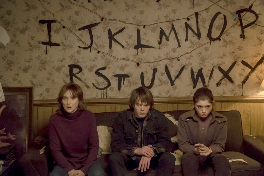 Winona Ryder as Joyce Byers, from left, Charlie Heaton as Jonathan Byers and Millie Brown as Eleven in the Netflix series &quot;Stranger Things,&quot; which begins streaming July 15.