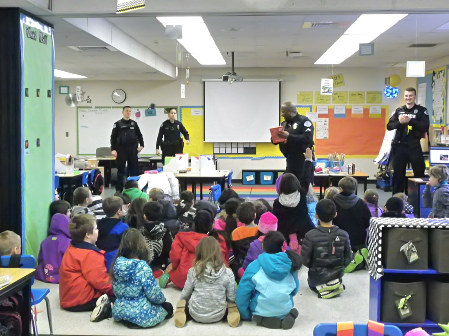 Officers from the Vancouver Police Activities League at Burton Elementary School for the league&#039;s final literacy event of the school year, where they read to kids, hand out free books and give a safety presentation.