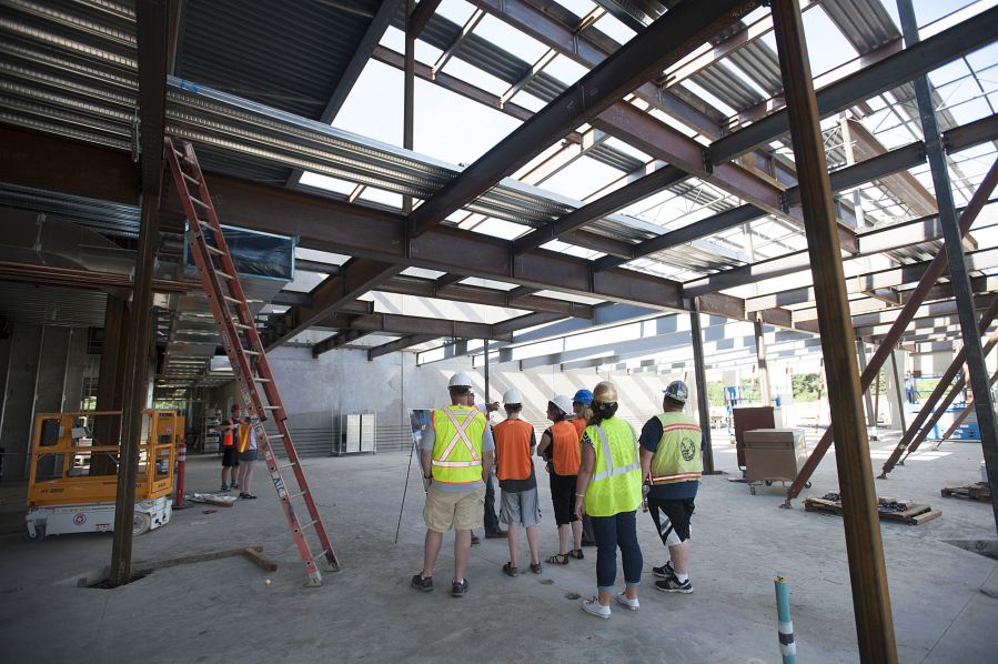 Visitors learn more about the facilities on the first floor Tuesday at the new Seton Catholic College Preparatory School under construction in Northeast Vancouver.