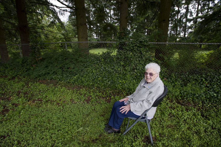 Hazel Stein, 99, enjoys the birds and squirrels June 2 in central Vancouver&#039;s Tanglewood Park. Behind the chain-link fence lies the land she is donating to the city to expand the park by nearly an acre. Additional land acquisitions will result in the park growing to a total 3.4 acres.