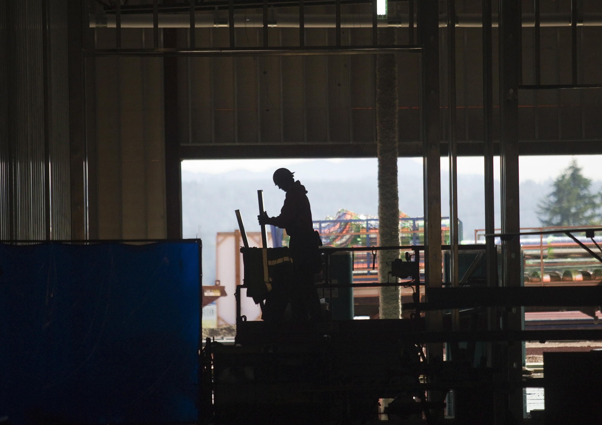 Construction workers labor at the Cowlitz Tribe's Ilani casino in June.