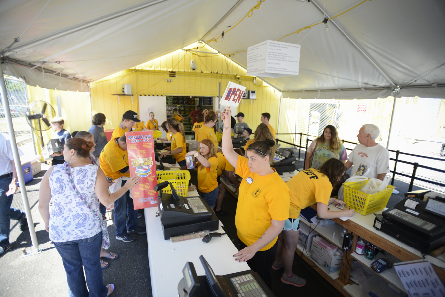 Customers file through the checkout at Blackjack Fireworks in Vancouver on Tuesday. Fireworks sales are expected to increase in the Northwest this year after leaving last year&#039;s hot and dry conditions behind.