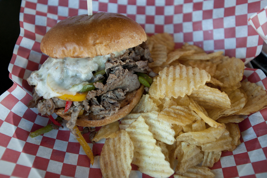 A Philly cheesesteak is served June 3 at Trusty Brewing Company in downtown Vancouver.
