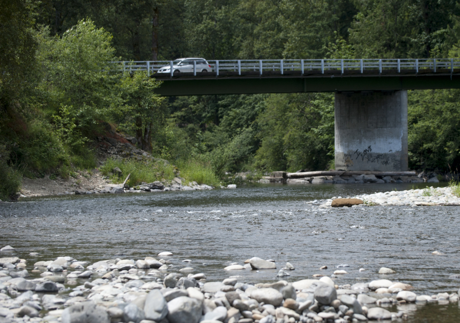 A motorist drives past Daybreak Regional Park near Battle Ground on June 14. Clark County is seeking grants to improve walking trails and salmon habitat along the river.