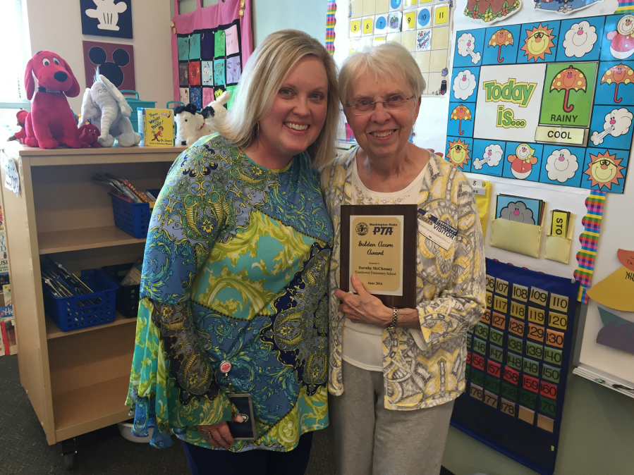 Dorothy McChesney, right, was given the Golden Acorn Award from the Eisenhower Elementary School Parent Teacher Association for her 40-plus years volunteering at the school, including spending one day a week working with her daughter, Connie McChesney, left.