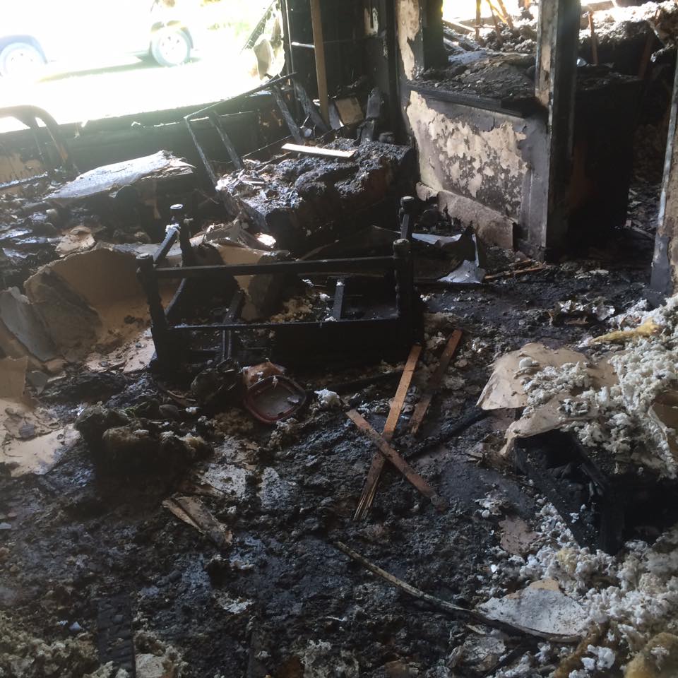 A fire ripped through this Salmon Creek home early Wednesday morning, displacing its three occupants and killing one of their dogs. The fire rekindled Wednesday late afternoon.