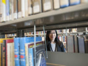 Reference librarian Supisa Oliver at work at the Vancouver Community Library in downtown Vancouver.