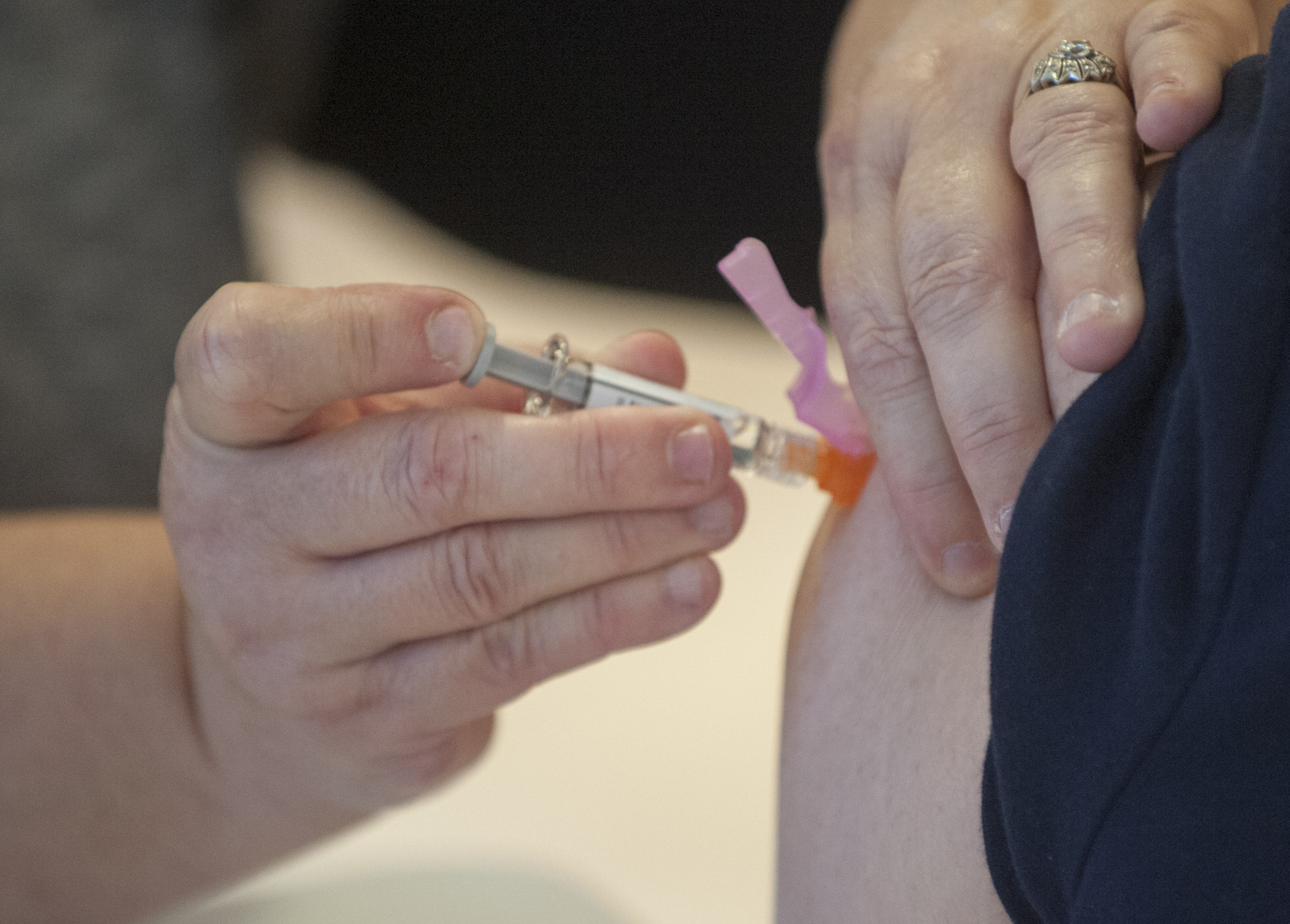 A nurse administers a flu shot in December at Legacy Salmon Creek Medical Center in Vancouver. Clark County's influenza season is over, local health officials said Wednesday.